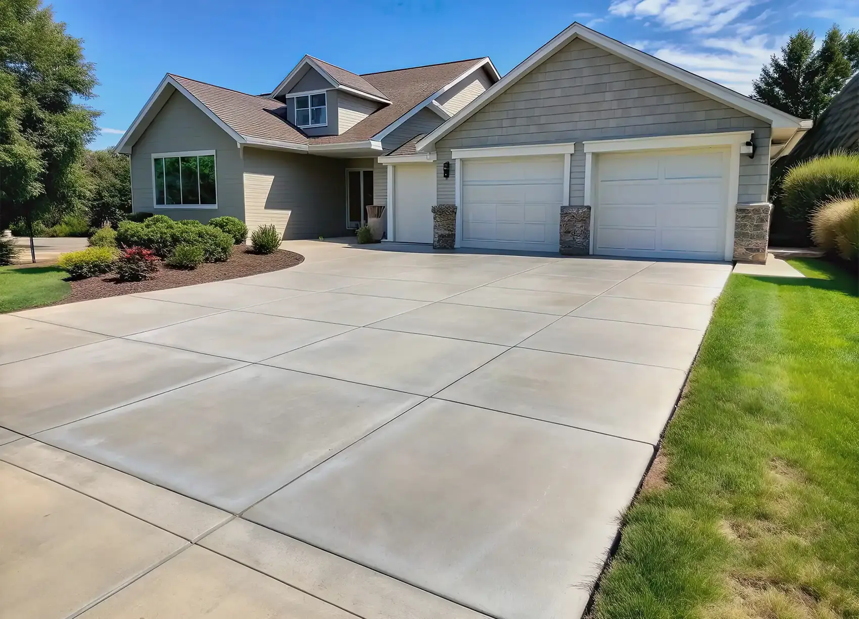 smooth concrete driveway residential home curb appeal Olympia Tacoma WA concrete vs pavers comparison